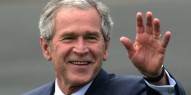 U.S. President George W. Bush waves upon arrival at RAF Aldg